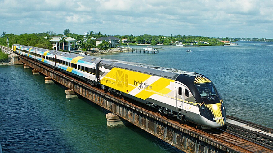 A high-speed Brightline train in motion